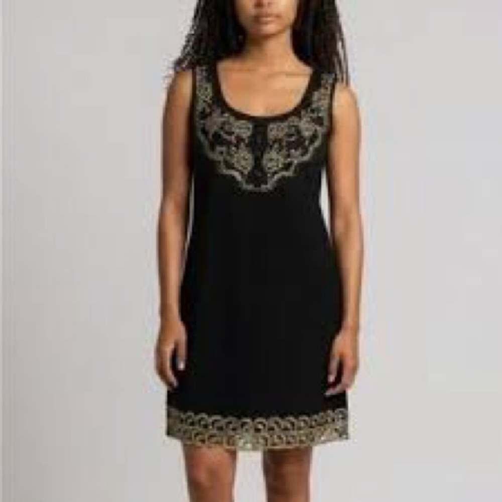 Free People sleeveless black dress with gold metallic embroidery.